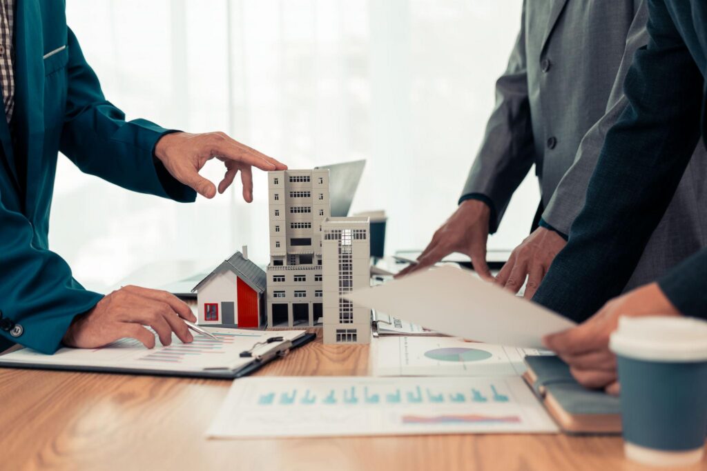 Mortgage broker discussing Expanded DSCR loan options with a real estate investor.